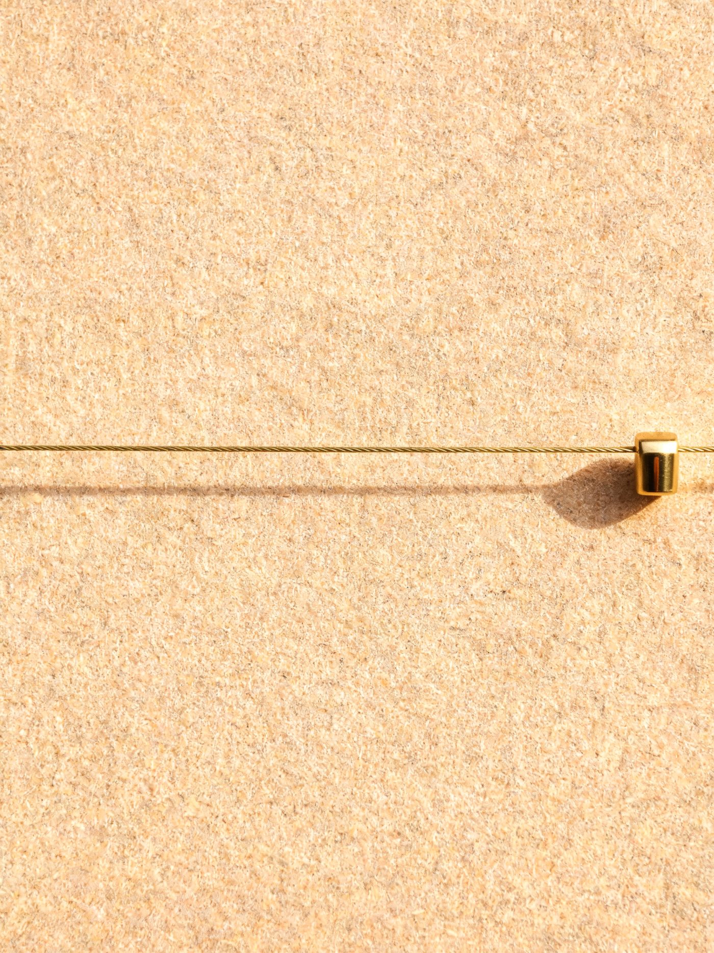 Connected — one taut brass line
